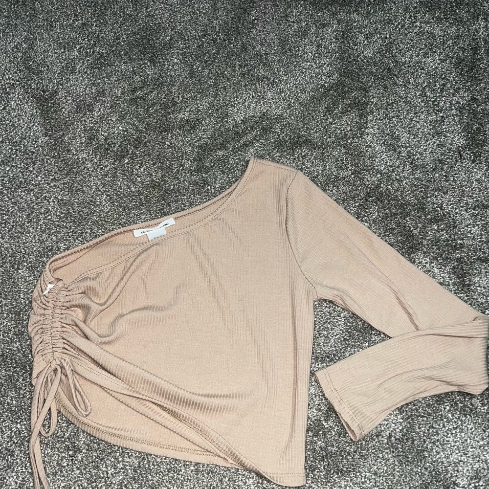 off the shoulder tan shirt